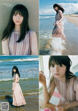 A woman with long black hair standing on a beach.