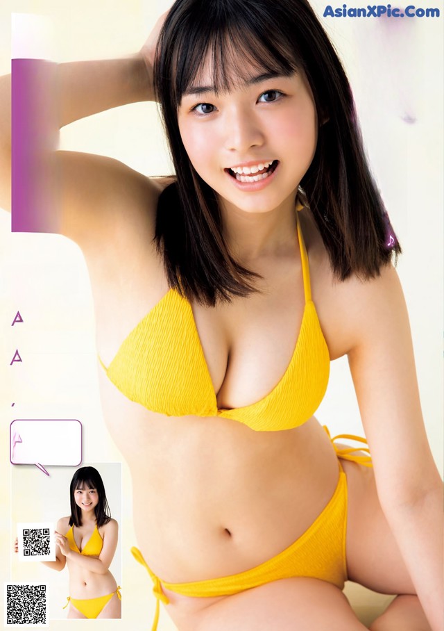 A woman in a yellow bikini posing for a magazine.