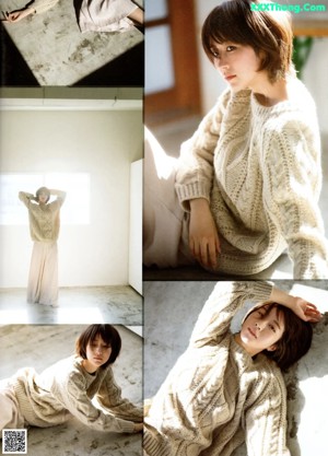 A woman sitting on the floor in a magazine.